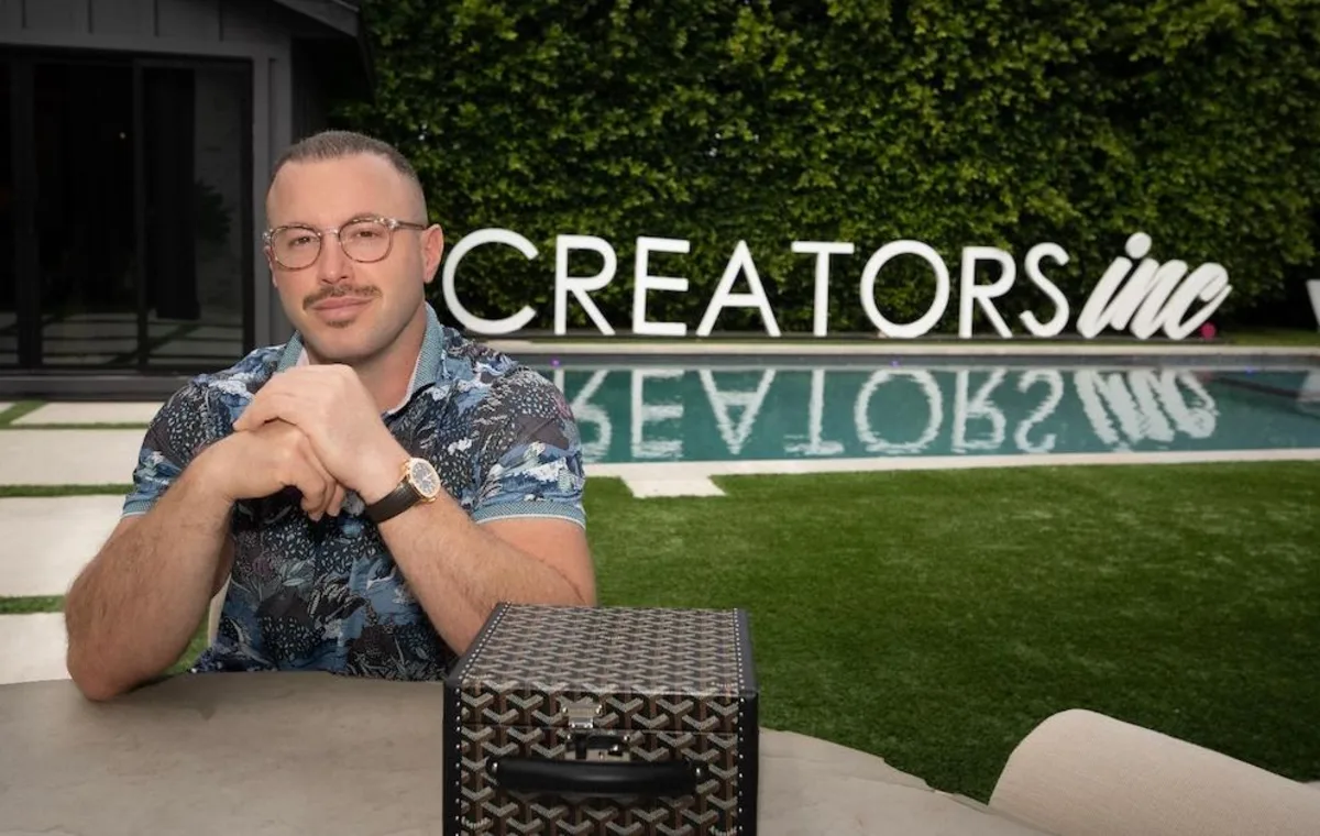Andy Bachman in front of a Creators Inc. tour bus