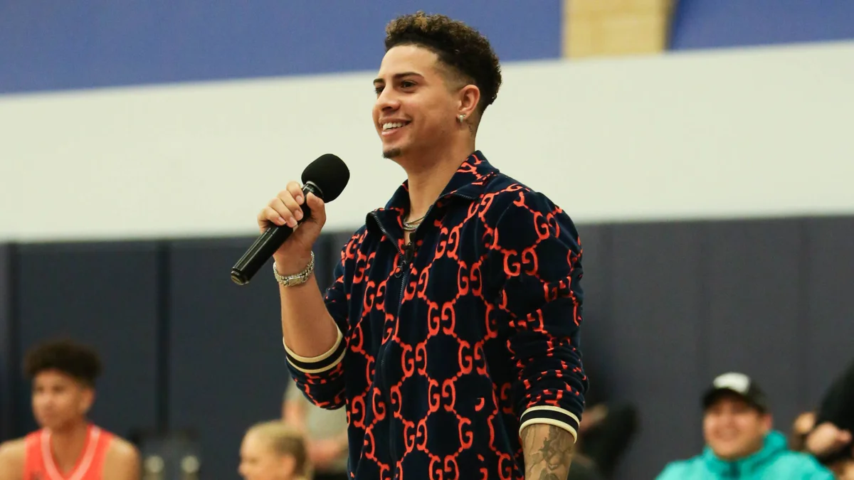 Austin McBroom speaking at a basketball event